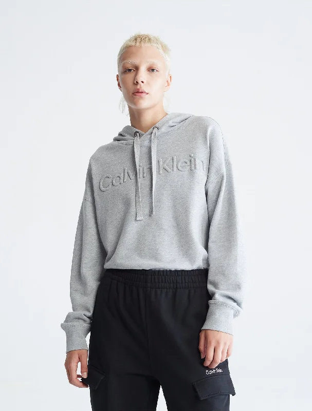 Calvin Klein Oversized Embossed Logo Hoodie - Women Hoodie with Half-Zip Sporty Casual Calvin Klein Oversized Embossed Logo Hoodie - Women Hoodie with Half-Zip Sporty Casual