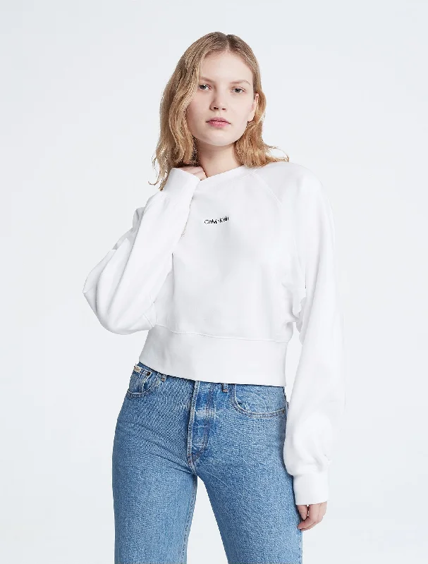 Calvin Klein Standard Logo Cinched Crewneck Sweatshirt - Women Hoodie with Bell Sleeves Flared Feminine Calvin Klein Standard Logo Cinched Crewneck Sweatshirt - Women Hoodie with Bell Sleeves Flared Feminine